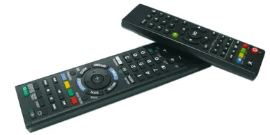 Two remotes are sitting next to each other.